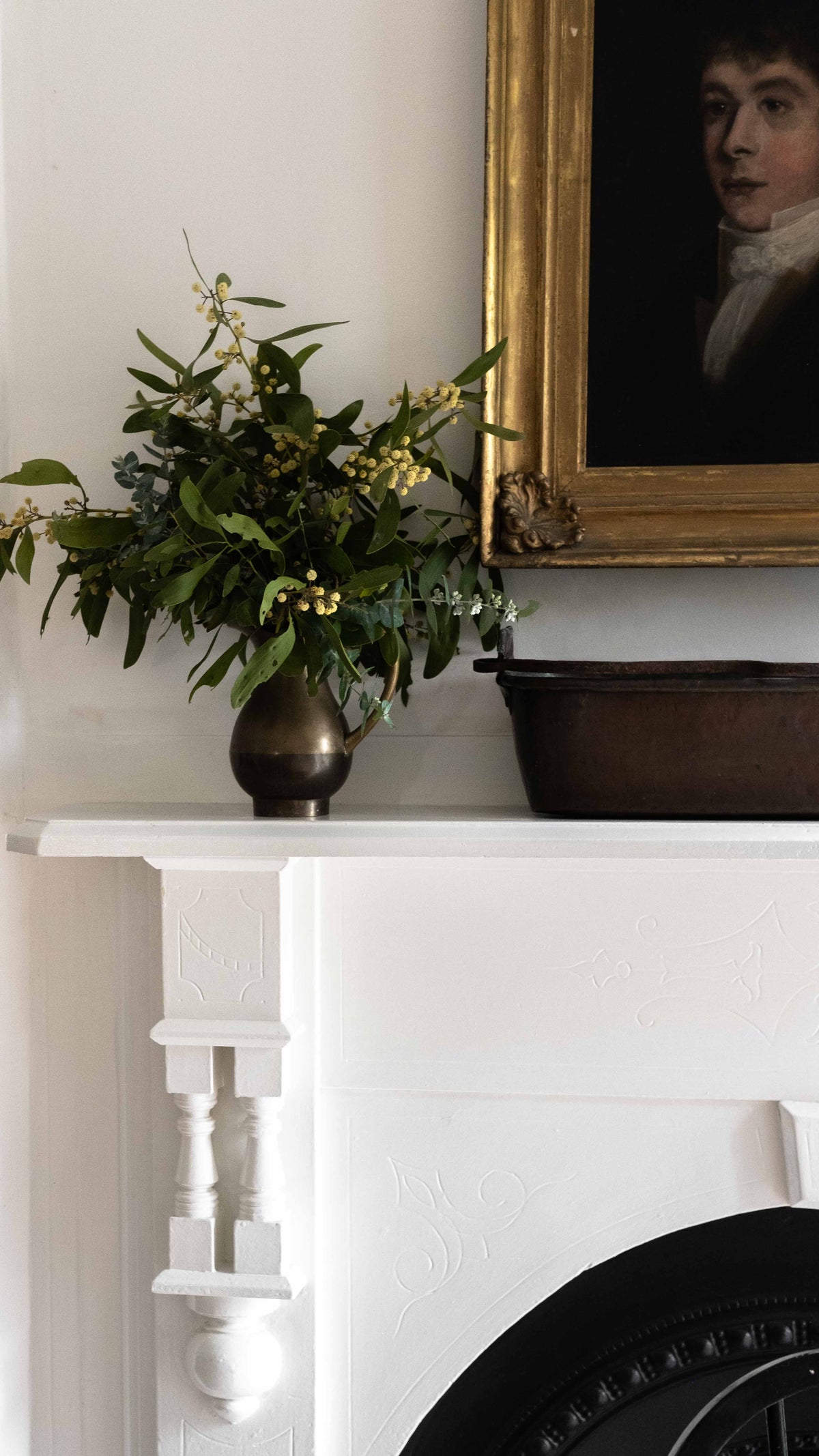 Fireplace with oil painting above the mantel